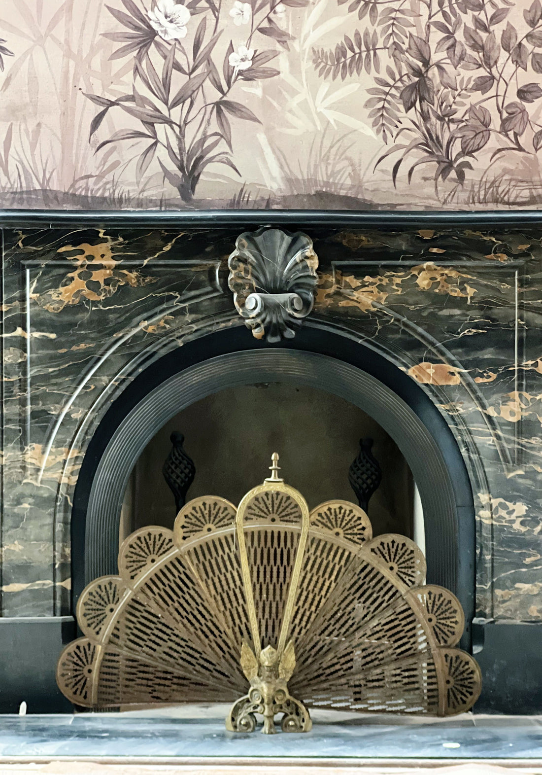 antique brass peacock fireplace screen in New Orleans home