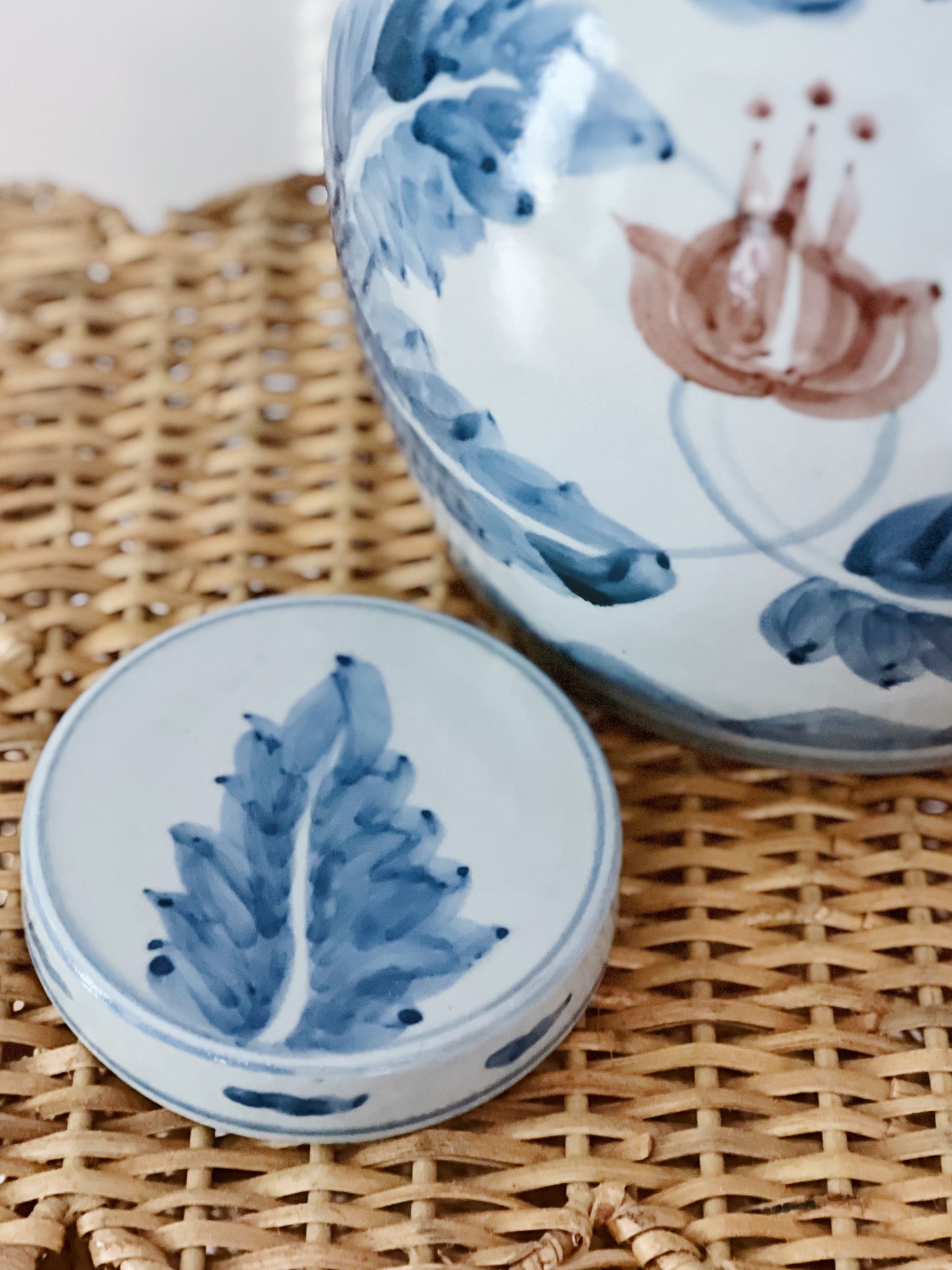 Blue and white ginger jar on a wicker pedestal 