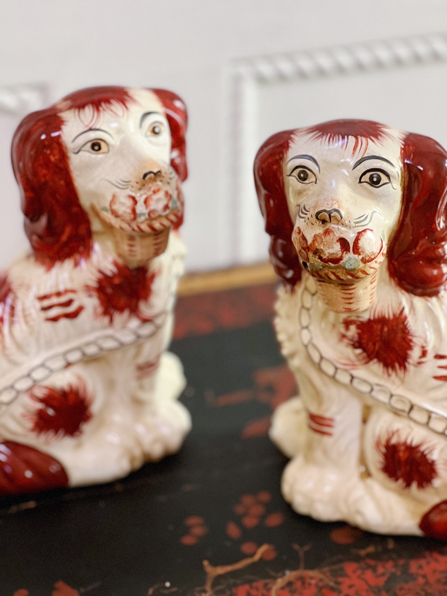 Brown and white staffordshire dogs with baskets