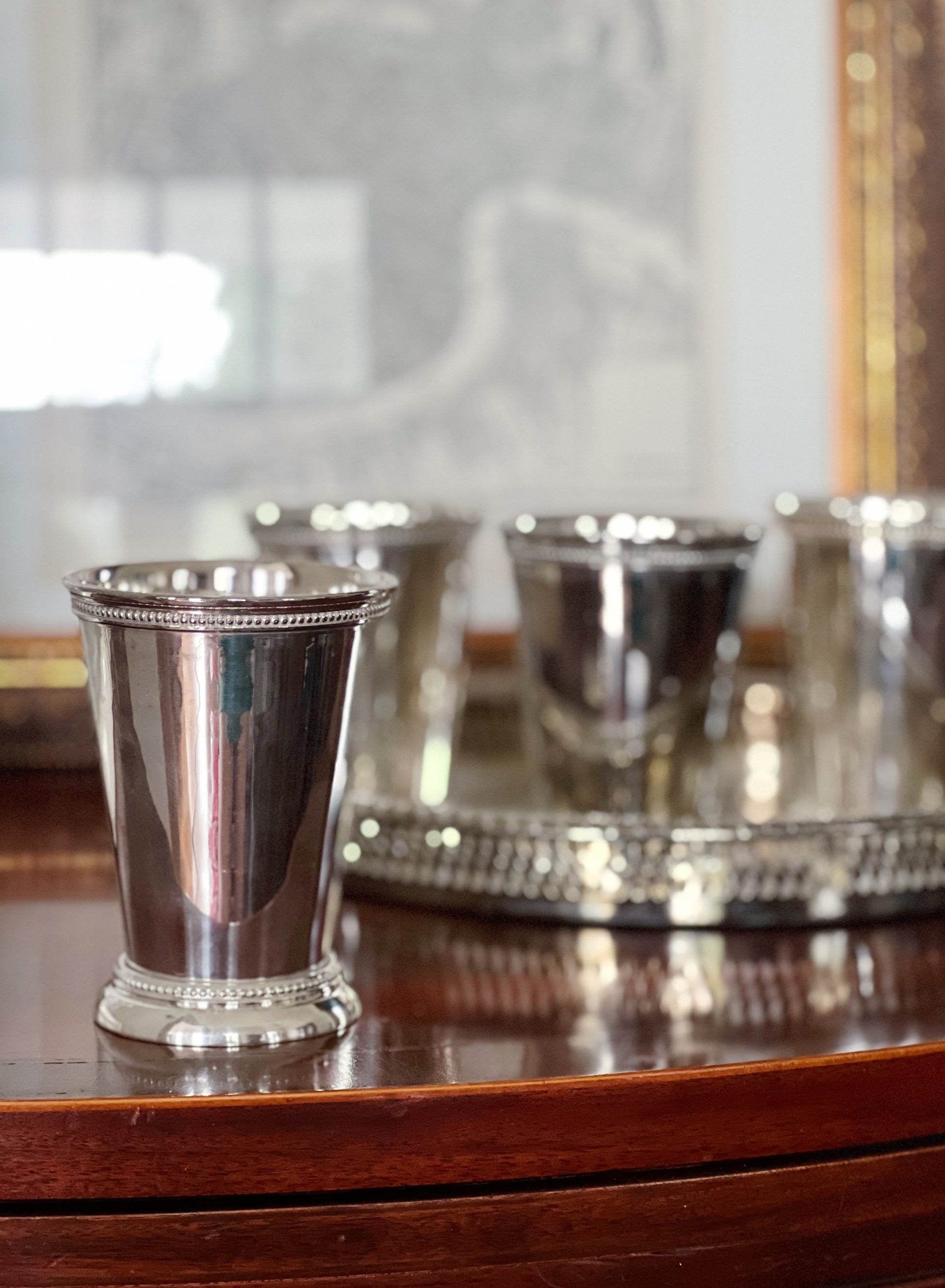 Vintage silver mint julep cups on a vintage serving tray
