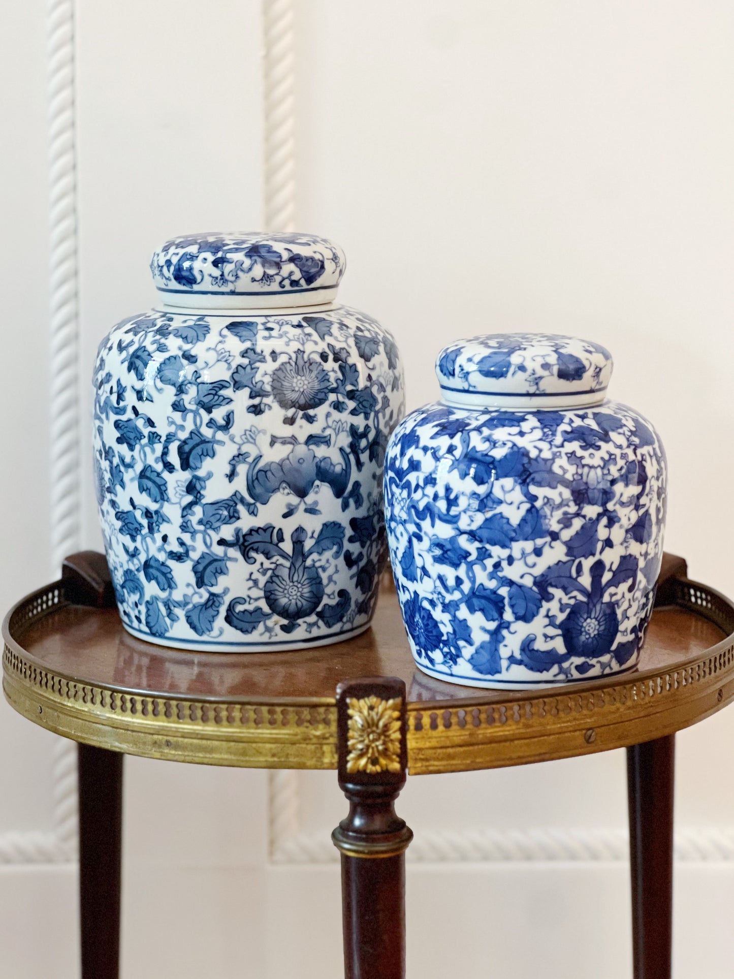 set of 2 scrolling peonies blue and white ginger jar on wooden table
