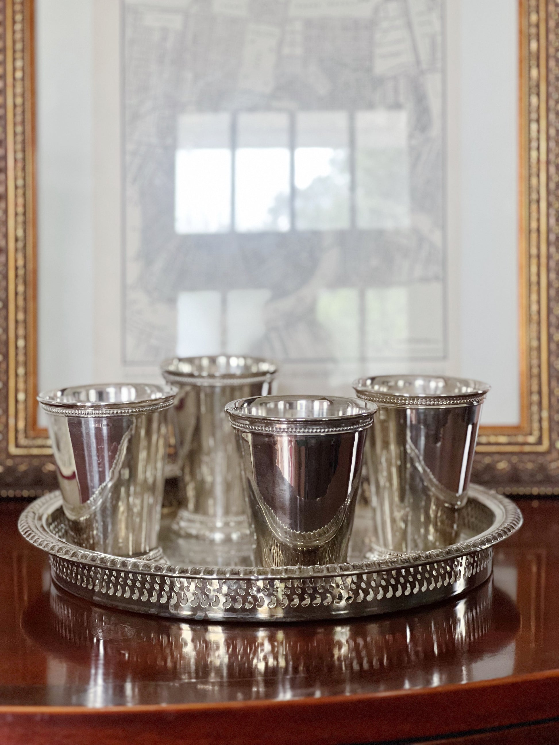 Vintage silver mint juleps cups in a vintage serving tray