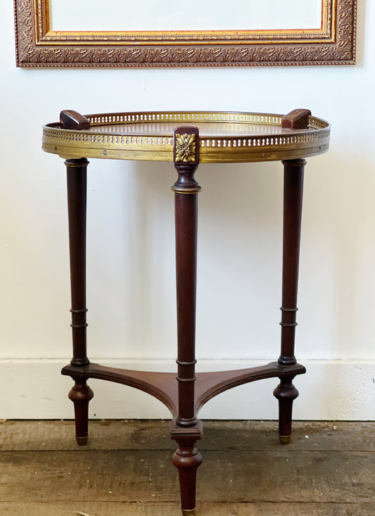 antique french walnut side table below artwork