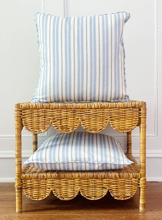 custom pillows in Newbury Antique Stripe on a scalloped wicker side table 